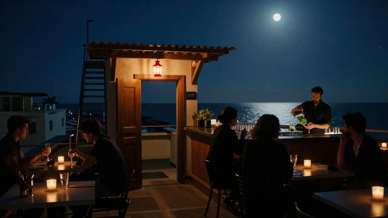 A hidden rooftop bar with a red lantern, overlooking the Mediterranean at night.
