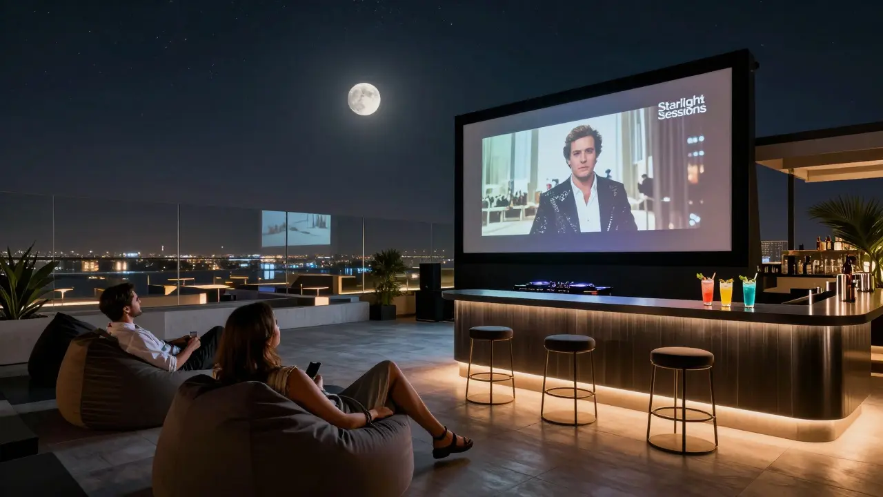 Couples relaxing on beanbags under a starry sky watching a film on a rooftop cinema screen in Dubai, with a DJ nearby.